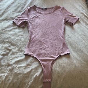 Mauve body suit with short sleeves